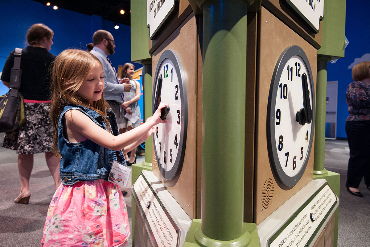 girl changing the time on the play clock